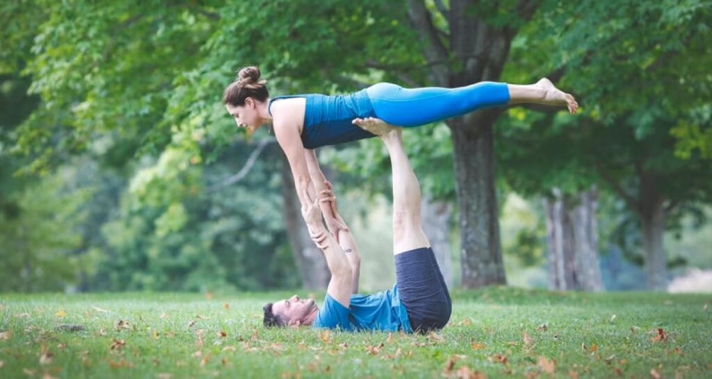 Infographic showing the physical, mental, and relationship benefits of partner yoga